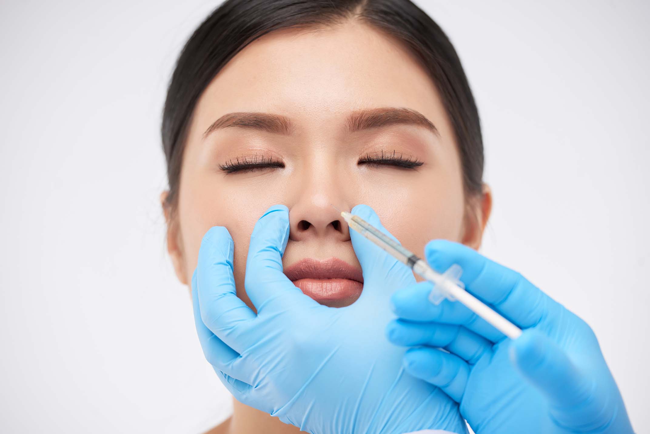 woman getting nonsurgical rhinoplasty